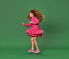 Girl dancing and wearing Limited Edition Everyday Original x2 in Pink and Yellow. APMA approved. Available at www.tenlittle.com