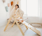 Child playing on the Piccalio Climber Pikler Triangle Set in bedroom. Available from www.tenlittle.com