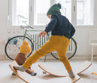 Child playing on the Piccalio Surfer Balance Board. Available from www.tenlittle.com