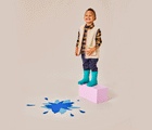 GIF boy playing and wearing Ten Little Rain Boots - Teal. Available at www.tenlittle.com