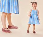 Split view of child wearing Ten Little Velvet Ballet Flats - Dusty Rose. Available from www.tenlittle.com