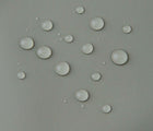 Close up waterproof material of Reima - Lammikko Waterproof Rain Pants - Greyish Green - Available at www.tenlittle.com