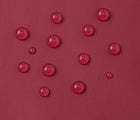 Close up waterproof material of Reima - Lammikko Waterproof Rain Pants - Jam Red - Available at www.tenlittle.com