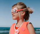 Girl at beach wearing Sunnylife Swim Goggles - Mermaid. Available at www.tenlittle.com