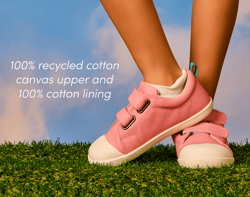 View of child wearing Ten Little Eco Canvas Sneakers - Piggy Pink made with a 100% recycled cotton canvas upper and 100% recycled cotton lining. Available at www.tenlittle.com