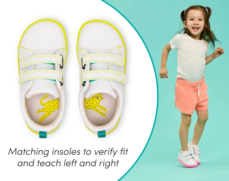 Split view of child and close up insoles of Ten Little Everyday Original - Neon Glow - Neon Yellow and Neon Pink. Available at www.tenlittle.com