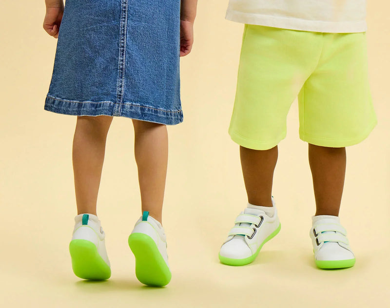 Split view of children wearing Ten Little Everyday Original - Neon Glow - Neon Green. Available at www.tenlittle.com