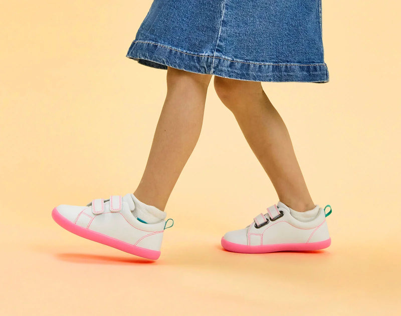 Side view of child wearing Ten Little Everyday Original - Neon Glow - Neon Pink. Available at www.tenlittle.com