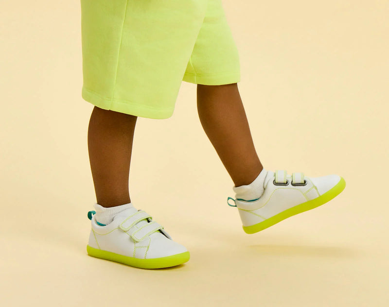 Side view of child wearing Ten Little Everyday Original - Neon Glow - Neon Yellow. Available at www.tenlittle.com