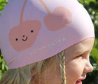 Girl wearing Sunnylife Swimming Cap - Cherry. Available at www.tenlittle.com