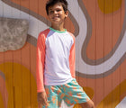 Boy wearing Snapper Rock UPF 50+ Swim Shorts - Lobsters. Available at www.tenlittle.com