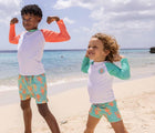 Boys at beach wearing Snapper Rock UPF 50+ Swim Shorts - Lobsters. Available at www.tenlittle.com