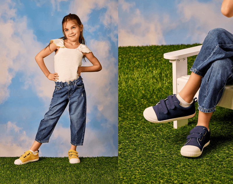 Split view of girl wearing Ten Little Eco Canvas Sneakers - Mellow Yellow and Navy Blue. Available at www.tenlittle.com