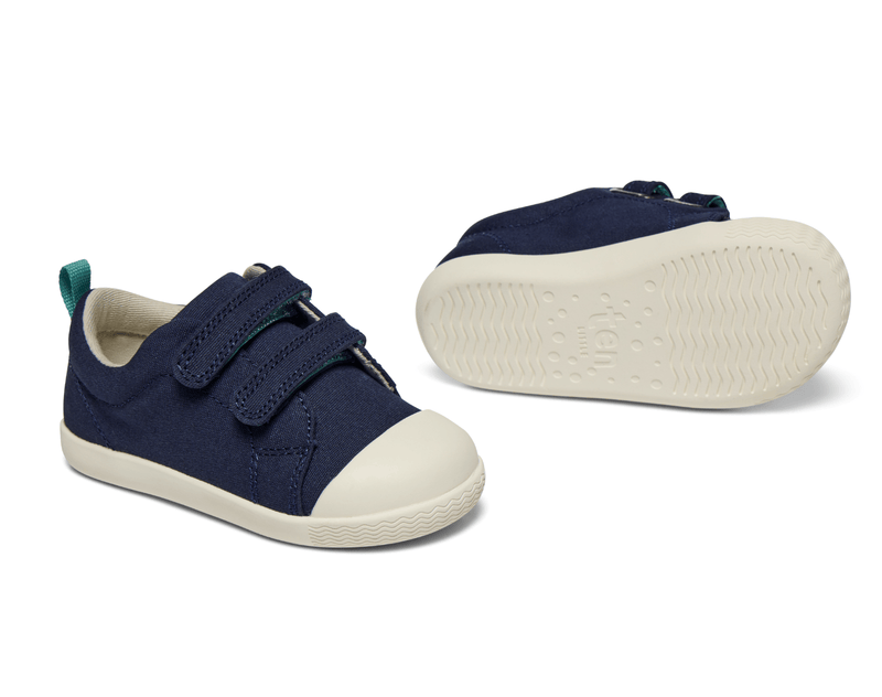 Side and bottom of shoe view of Ten Little Eco Canvas Sneakers - Navy Blue. Available at www.tenlittle.com