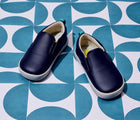 Front view of Ten Little Slip-On Sneakers - Navy Blue. Available at www.tenlittle.com