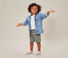 Child wearing Ten Little Slip-On Sneakers - Blush Pink. Available at www.tenlittle.com