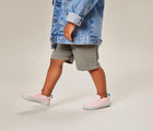Child wearing Ten Little Slip-On Sneakers - Blush Pink. Available at www.tenlittle.com