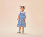 Child wearing Ten Little Slip-On Sneakers - Moondust Silver. Available at www.tenlittle.com