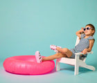 Girl sitting wearing Ten Little Splash Sandals 2 - Lavender Purple. Available at www.tenlittle.com