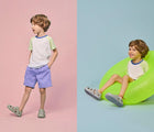 Split view of boy wearing Ten Little Splash Sandals 2 - Pebble Gray. Available at www.tenlittle.com