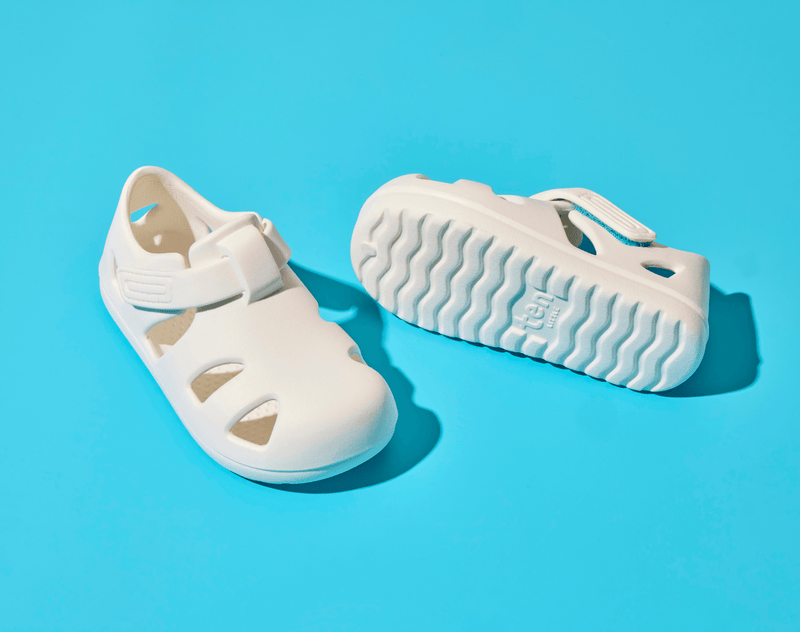 Top and bottom of shoe view of Ten Little Splash Sandals 2 - Soft White. Available at www.tenlittle.com