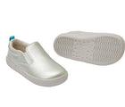 Front and bottom of shoe view of Ten Little Slip-On Sneakers - Moondust Silver. Available at www.tenlittle.com