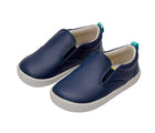 Side and front view of Ten Little Slip-On Sneakers - Navy Blue. Available at www.tenlittle.com