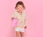 Child wearing Babiators Flower Sunglasses. Available from www.tenlittle.com