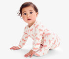Baby wearing Primary Baby Onesie PJs - 2 Pack - Blossom Zebras. Available at www.tenlittle.com