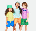Child with friends wearing Primary Long Sleeve Rash Guard in Mist - 2 Pack - Mist / Green Apple. Available at www.tenlittle.com