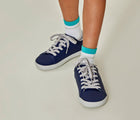 Boy wearing Ten Little Classic Sneakers Youth - Navy Blue. Available at www.tenlittle.com