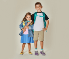 Big brother with little sister wearing Ten Little Classic Sneakers Youth - Power Purple. Available at www.tenlittle.com