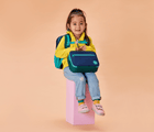 Girl carrying Ten Little Insulated Recycled Lunch Box - Navy & Green. Available at www.tenlittle.com