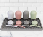 ezpz Drying Rack in gray with ezpz items drying on it. Available at tenlittle.com