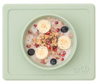Food inside Ezpz Mini Bowl in sage. Available at www.tenlittle.com