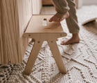 Child's feet about to step on All Circles One Step Stool in playroom. Available from tenlittle.com