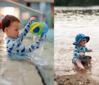 Two children playing in water wearing Jan & Jul Long Sleeve UV Sun Suit in Whale. Available from tenlittle.com