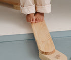 Close up of child balancing on the Piccalio Wooden Balance Beam. Available from www.tenlittle.com