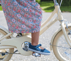 Little Girl Riding a Bike wearing Ten Little Canvas Mary Janes in Navy Blue - Available at www.tenlittle.com