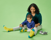Mom and Baby Playing and wearing Ten Little Family Socks Collection - Available at www.tenlittle.com