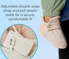 Split view of adjustable double-snap strap and soft, elastic ankle for a secure, comfortable fit and baby wearing Ten Little Everyday Baby Booties - Heather Oat. Available at www.tenlittle.com
