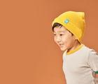 Little boy wearing Ten Little Knit Beanies Mariegold Yellow - Available at www.tenlittle.com