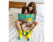 Mom and Baby in the bed reading and wearing Ten Little Family Socks Collection - Available at www.tenlittle.com
