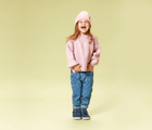 Girl Standing Wearing Ten Little Knit Beanies Blush Pink - Available at www.tenlittle.com