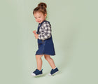 Little girl walking and wearing TenLittle-First-Walker Navy Blue - Available at www.tenlittle.com