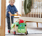 Boy playing HABA Dragon Wagon Baby Walker - Available at www.tenlittle.com