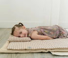 Child Lying at the Bloomere Portable Bedding Set - Brown checkered - Available at www.tenlittle.com