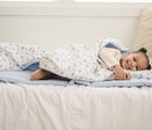 Baby Lying at Bloomere Portable Bedding Set - Dove - Available at www.tenlittle.com