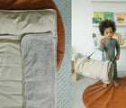 Baby Holding Bloomere Nap Mat - Polka Dot - Available at www.tenlittle.com