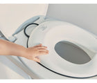 Baby Holding in a toilet bowl - BabyBjorn Toilet Training Set - White/Black - Available at www.tenlittle.com